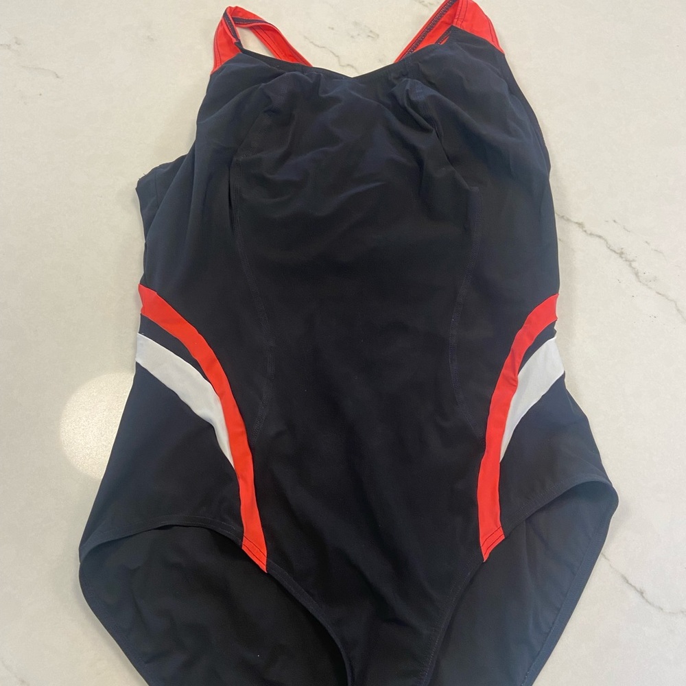 Black, pink and white women’s swimsuit.